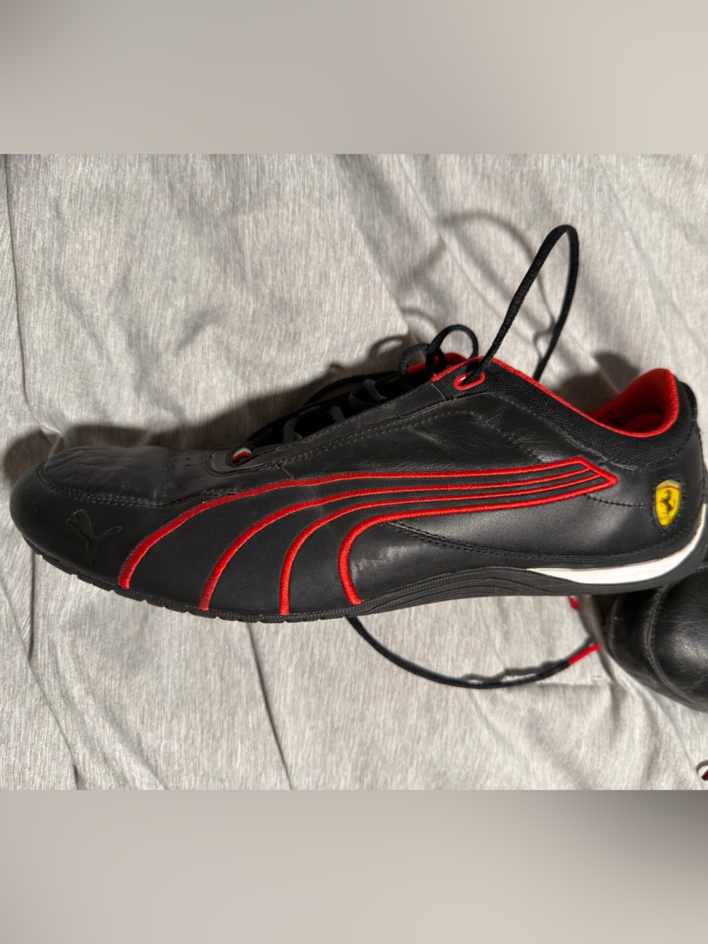 Puma Black Sneakers with Red Accents